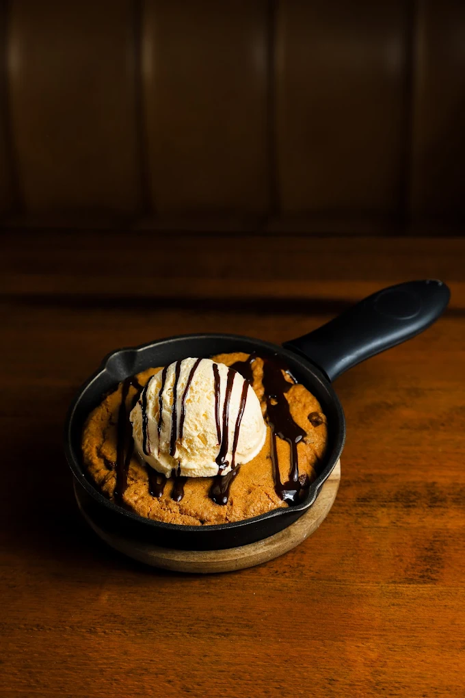 Warm skillet cookie topped with ice cream